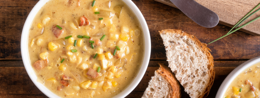 creamy corn chowder with bacon and potatoes with sliced bread