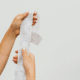 how to negotiate returns for purchases woman holding long receipt