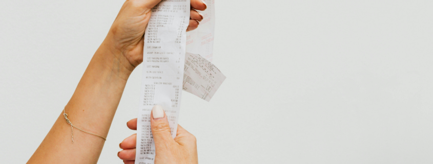 how to negotiate returns for purchases woman holding long receipt
