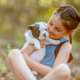 young girl holding brand new bulldog puppy