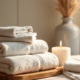 ow to get the smell out of towels stack of towels sitting with candle in bright natural light