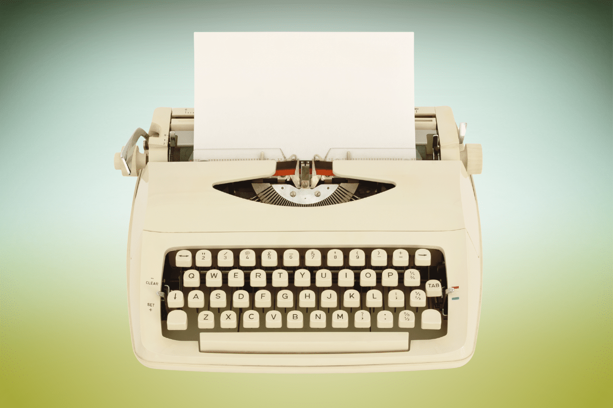 old typewriter on vintage gradient background