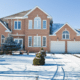 how to winterize your home snowy driveway suburban home