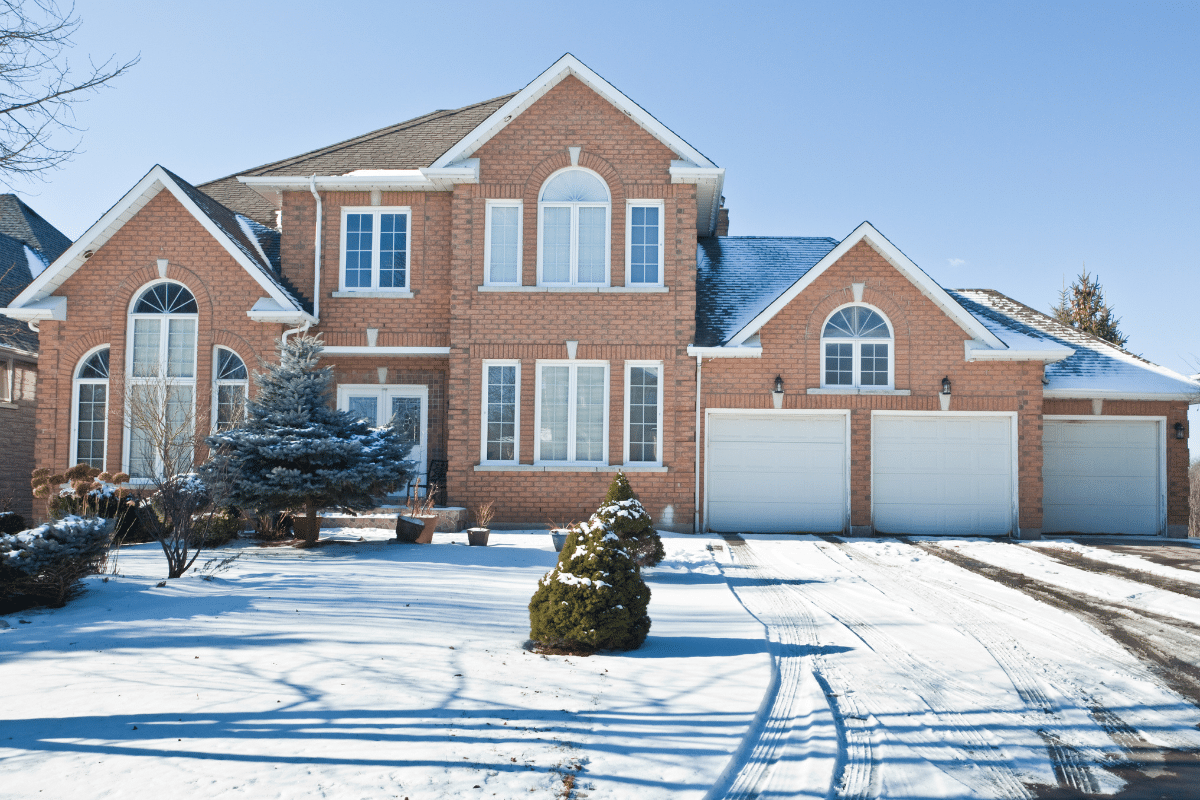 how to winterize your home snowy driveway suburban home