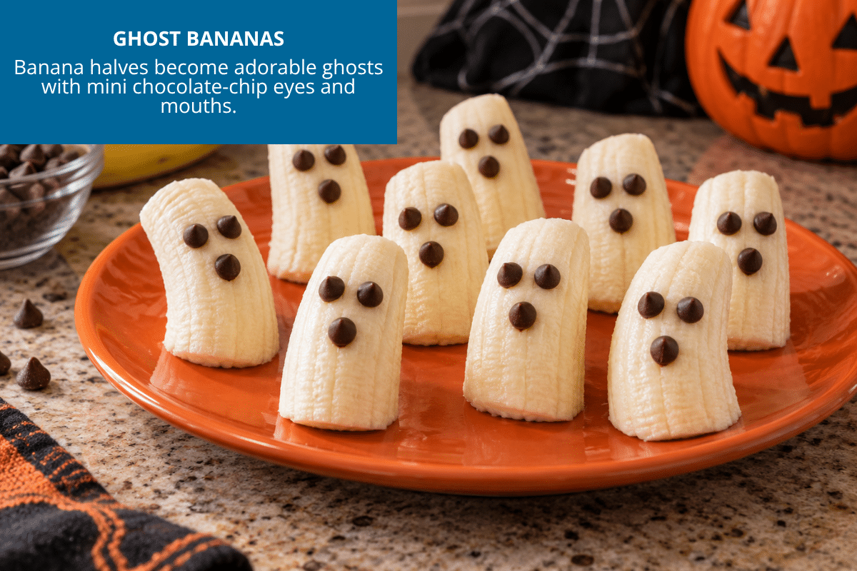 ghost bananas cut in half with chocolate chips for eyes and nose