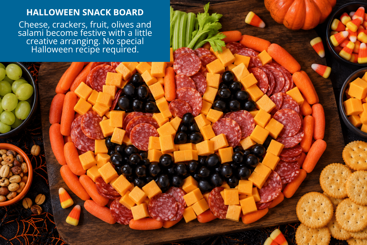 alloween snack board charcuterie salami carrots cheese cubes olives pumpkin candy corn
