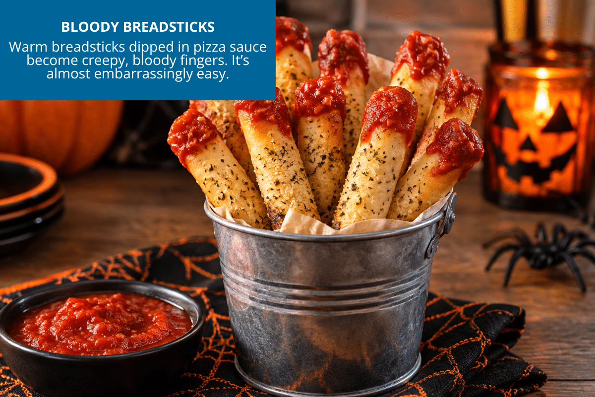 bloody breadsticks halloween snack dipped in red marinara