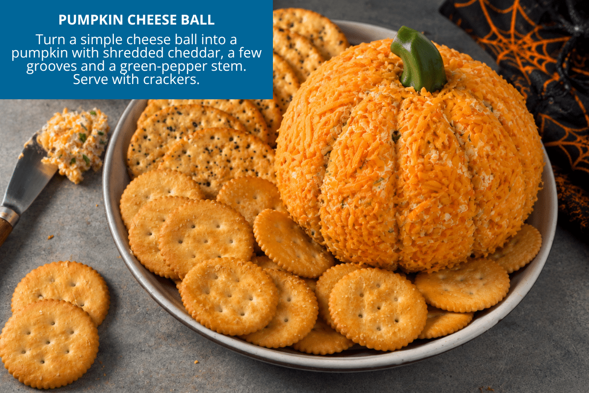 pumpkin cheese ball using cheddar and a green pepper stem for halloween appetizer party