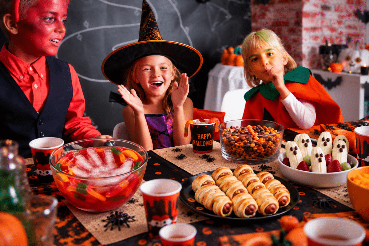 cheap Halloween party snacks for kids punch bowl mummy dogs ghost bananas