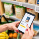 Shopper comparing a digital shelf price with a price on a smartphone
