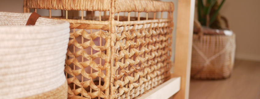 Woven basket container hidden on low entry shelf