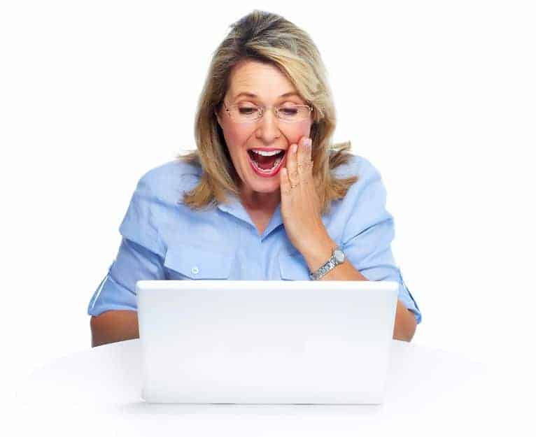A woman looking at a laptop