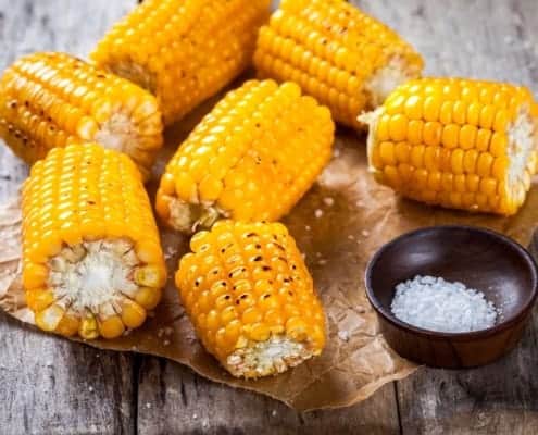 Food on a table, with Corn on the cob and Sweet corn