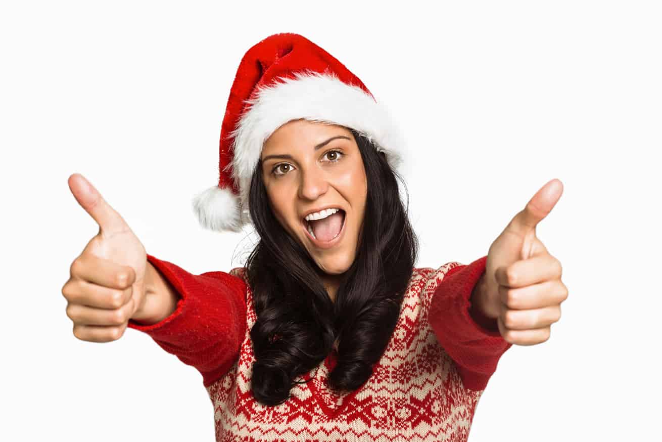 Woman giving a thumbs up on no christmas credit card debt white background