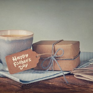 Gift box with a tag and a cup of coffee