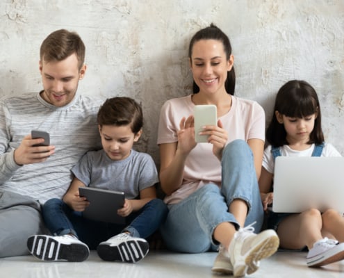 family using mobile devices