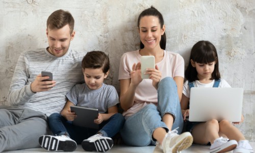 family using mobile devices