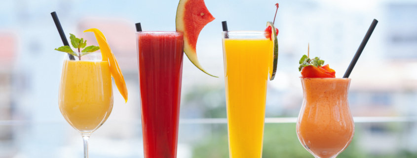 summer frozen drinks in fancy glassware