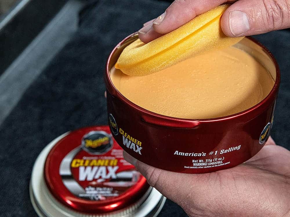 A cup of coffee, with Wax and Car