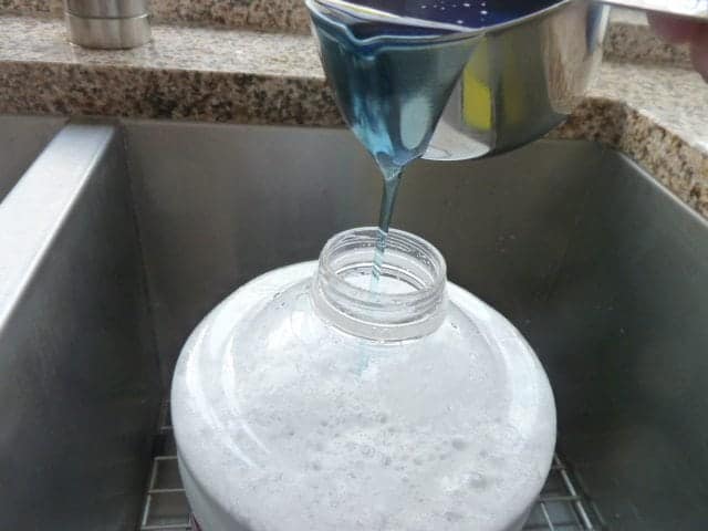 A glass of wine, with Detergent and Laundry