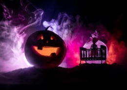 scary halloween vignette of pumpkins and ghosts
