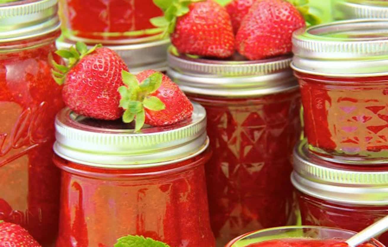 strawberry freezer jam in jars.