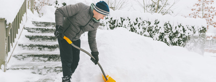 a-man-shovelling-snow-in-winter-