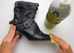 cleaning black leather boot with olive oil