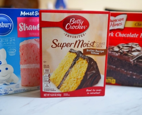 boxes of cake mix on marble counter for cake mix hacks recipes