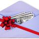 open a paper envelope with the dollars tied with red ribbon and bow.