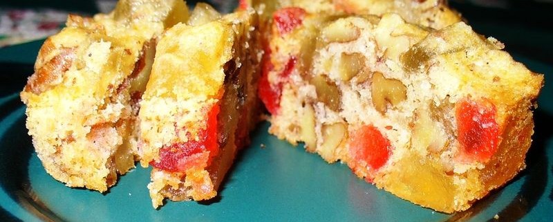 A close up of a slice of pizza on a plate, with Fruitcake
