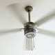 Ceiling fan is rotating at the ceiling of the room. Electric climate equipment.