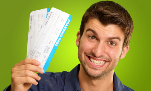 A Young Man Holding Tickets On Green Background