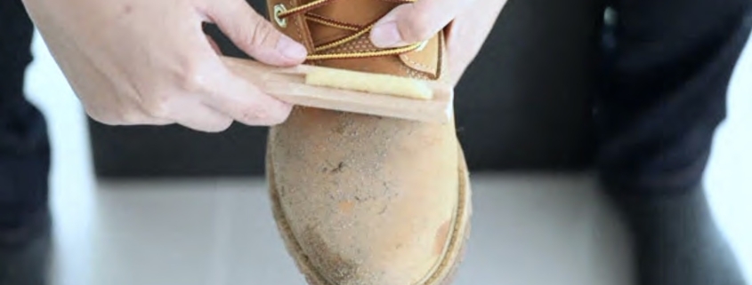 how to clean suede shoes man cleaning mud from work boot