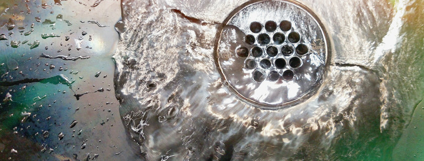 sink drain unclogged with clear water running freely