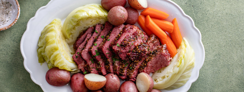 Corned beef with cabbage and potatoes on a serving platter