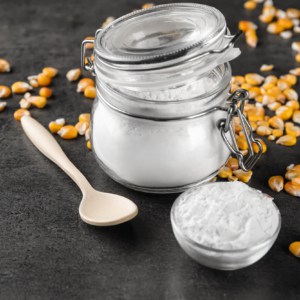 Jar and bowl with corn starch on table