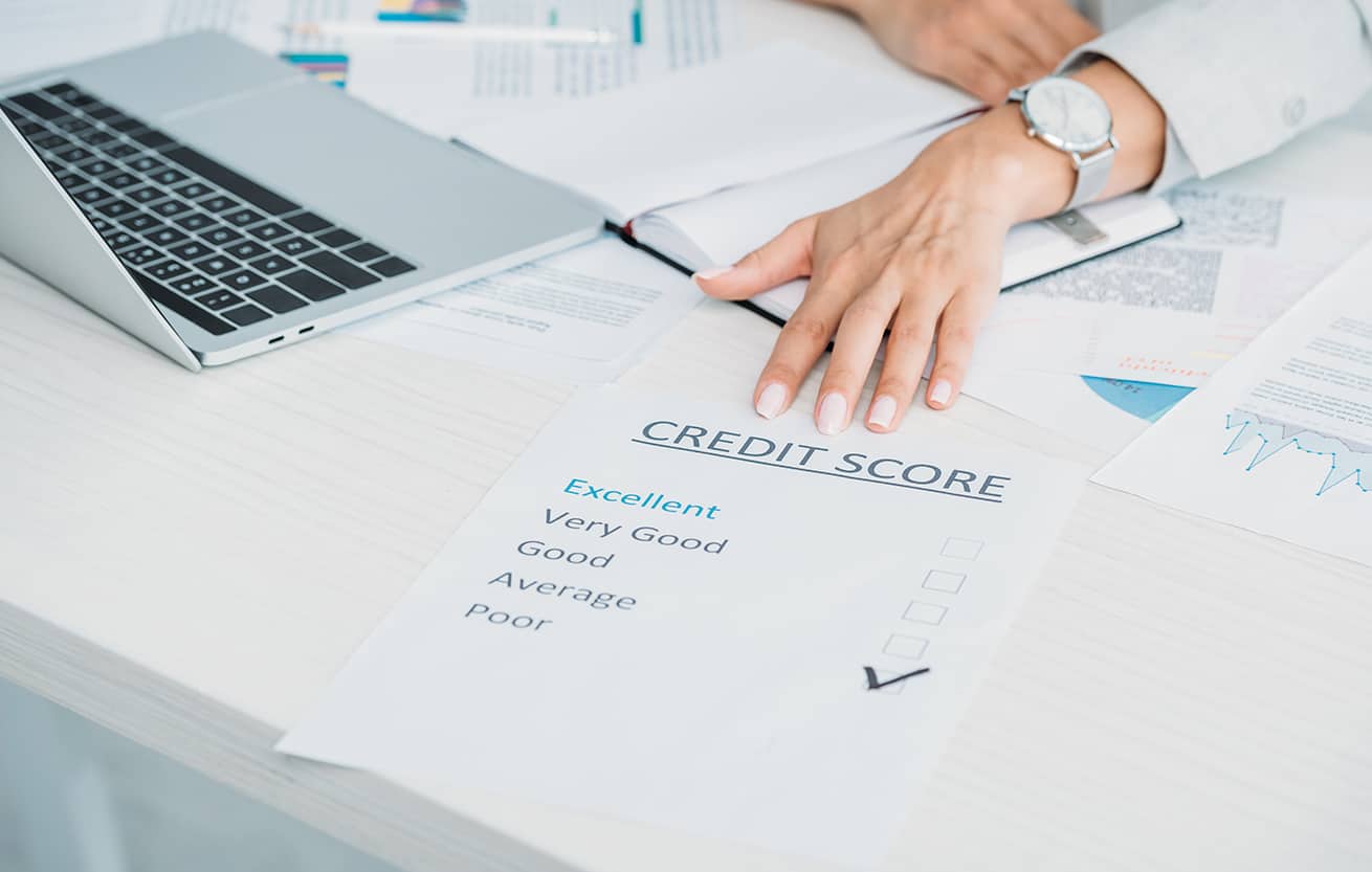 cropped view of woman showing credit score at office