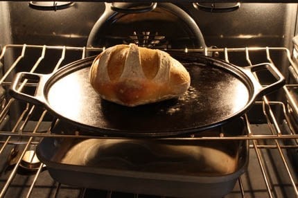 A close up of a metal pan on a stove top oven, with Dough and Yeast