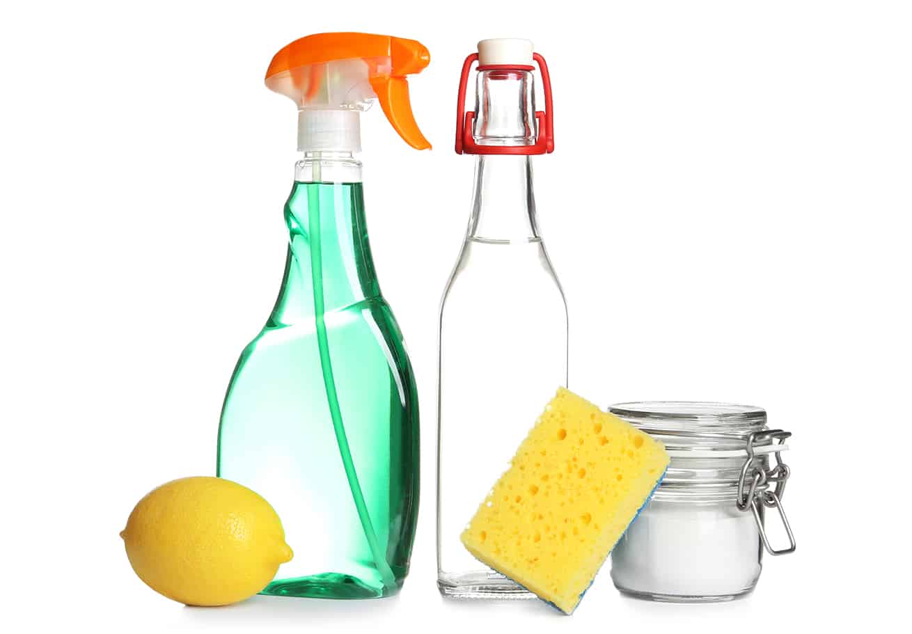 Composition with vinegar, lemon and baking soda on white background. House cleaning
