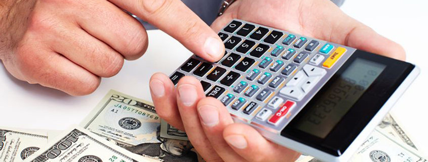 hand with a calculator. money saving concept.