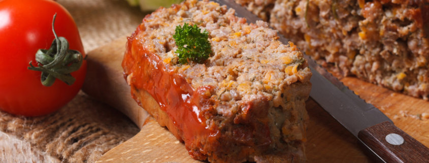 meat loaf with vegetables close-up on a cutting board. horizontal