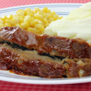meat loaf on plate with potaotes and corn