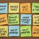 popular new year resolutions - colorful sticky notes on a cork board