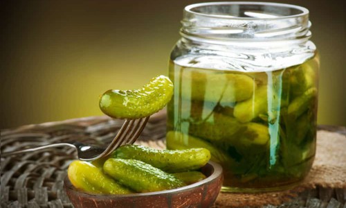 pickles in a jar and a bowl