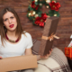 disappointed woman opening a gift box for Christmas
