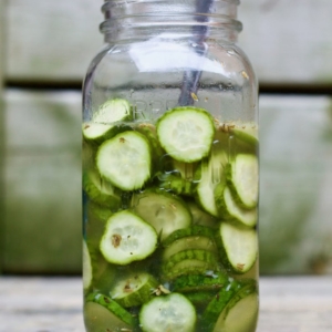 A close up of a wine glass, with Cucumber