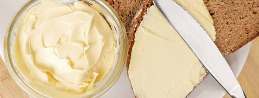 soft spreadable butter on brown bread
