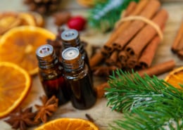 Christmas essential oils in small bottles. Selective focus. fresh smell fragrance stovetop simmer