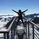 Woman hands up success concept reachingn mountaintop goal